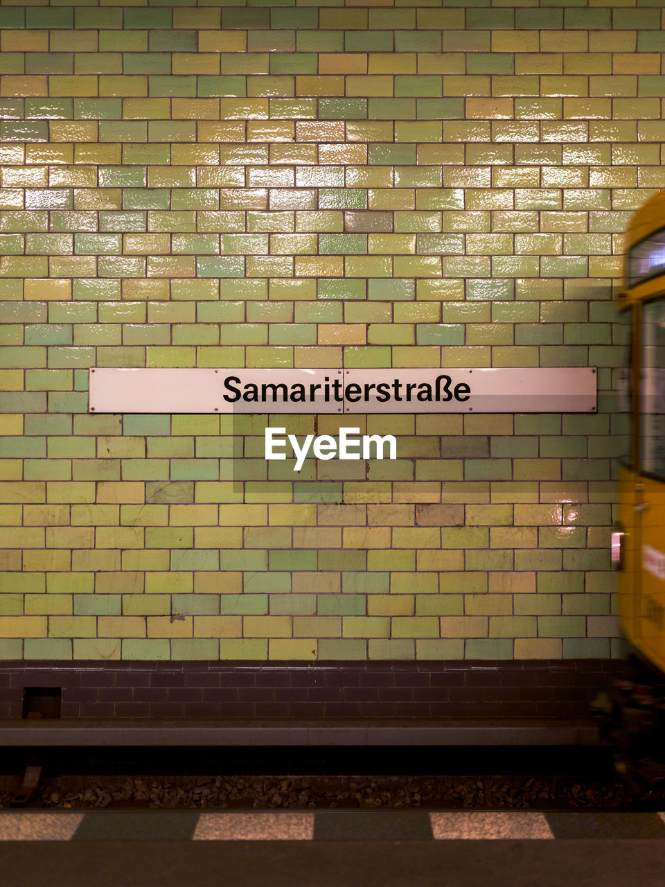 Text on wall at subway station