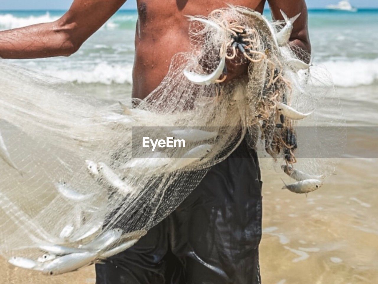 water, sea, beach, adult, one person, land, nature, day, motion, men, outdoors, person, clothing, focus on foreground, midsection, wet, sand, animal, splashing, leisure activity, lifestyles, holiday, vacation, standing, trip, women, young adult, close-up, wave