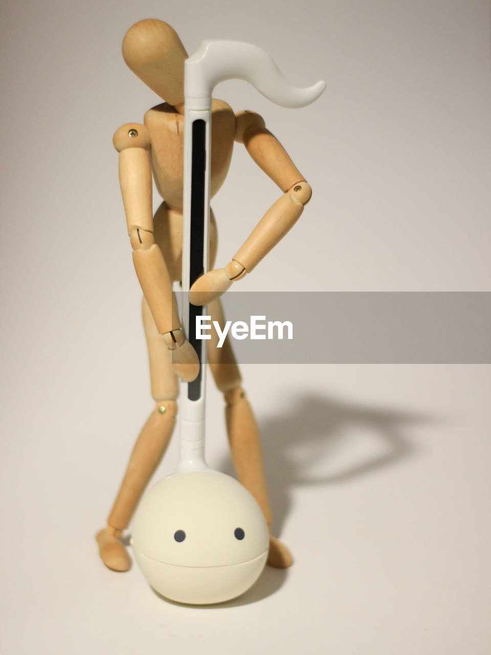 CLOSE-UP OF FIGURINE ON TABLE