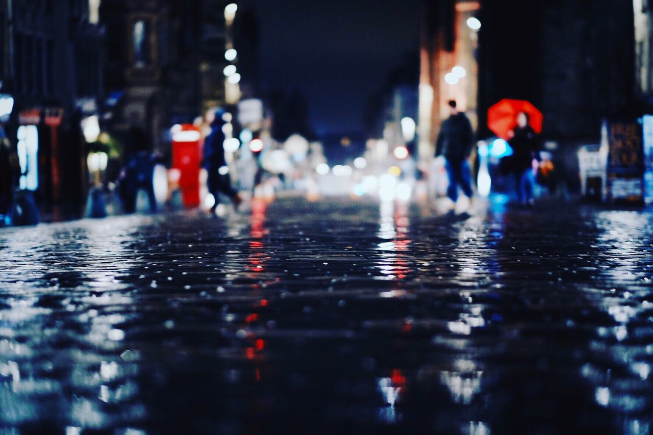 CLOSE-UP OF WET ILLUMINATED WATER