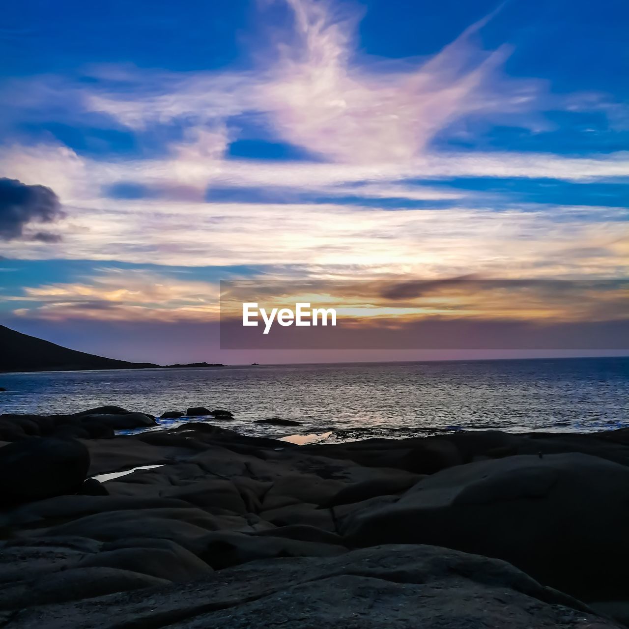 Scenic view of sea against sky during sunset