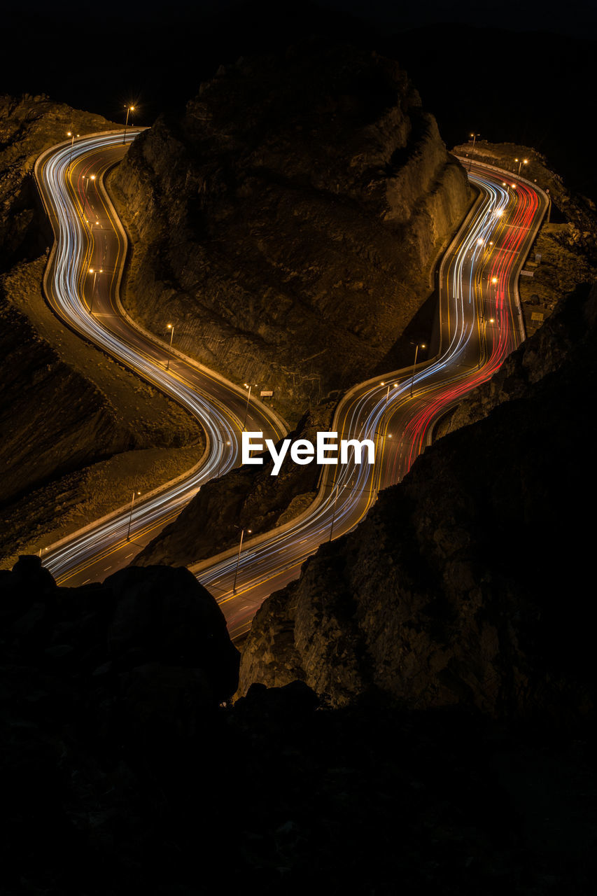 High angle view of light trails on road at night