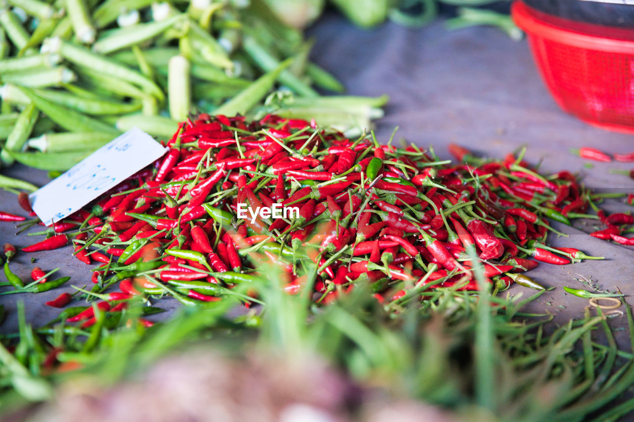 CLOSE-UP OF RED CHILI PEPPER FOR SALE AT MARKET