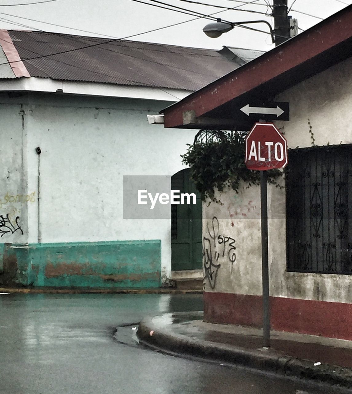 ROAD SIGN ON SIDEWALK