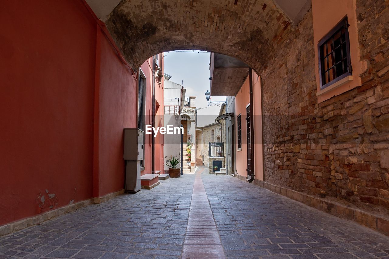 Narrow alley amidst buildings