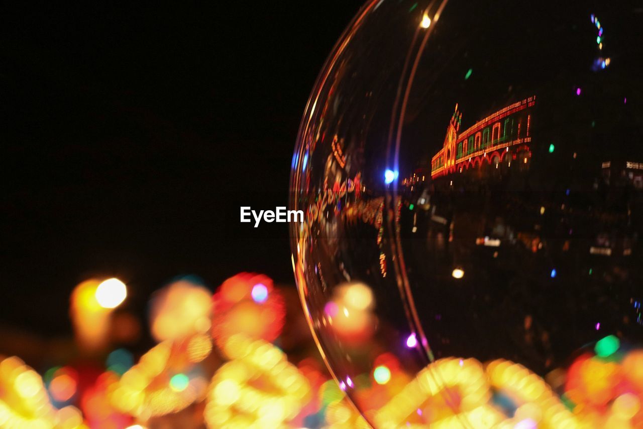 Close-up of illuminated lights at night