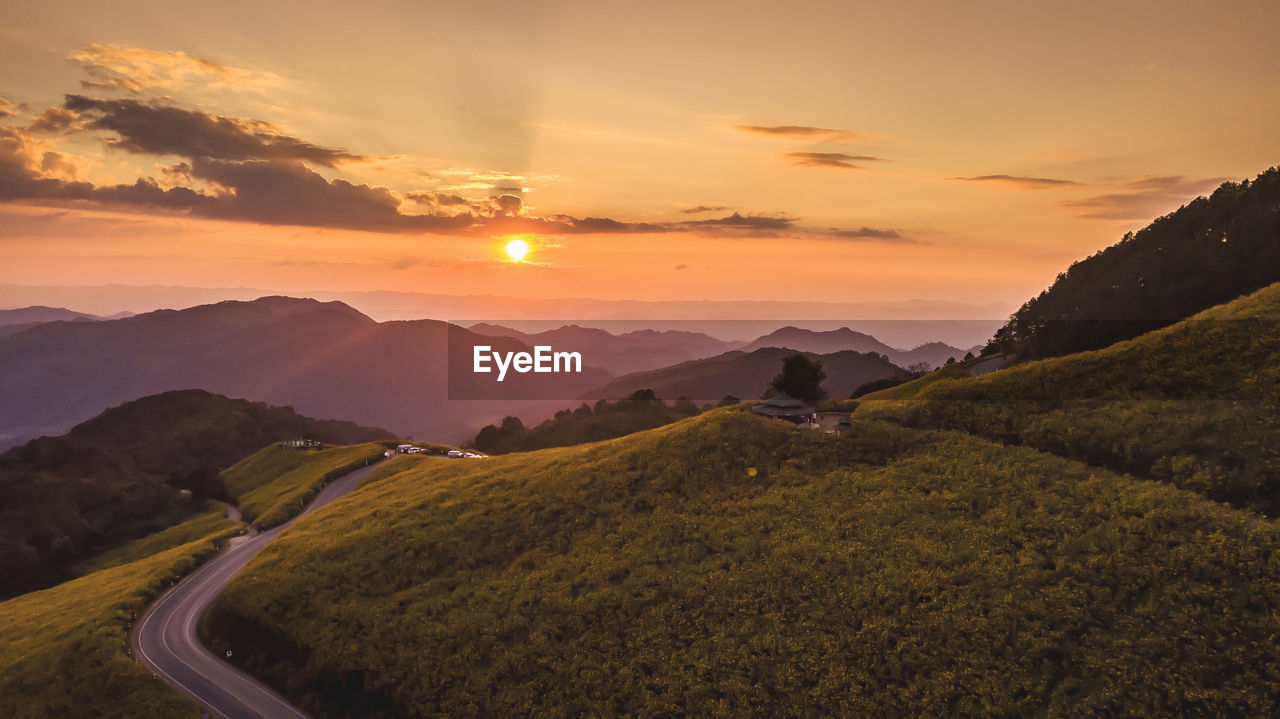 Scenic view of landscape against sky during sunset