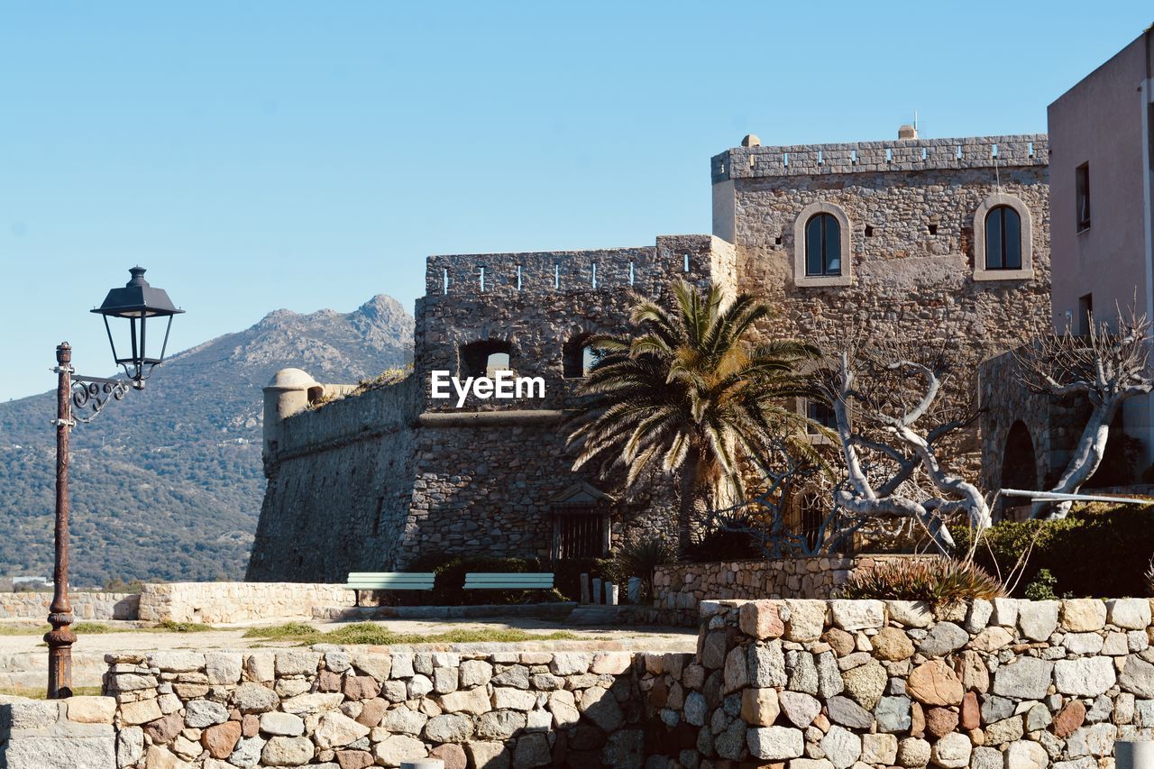 OLD BUILDING AGAINST CLEAR SKY