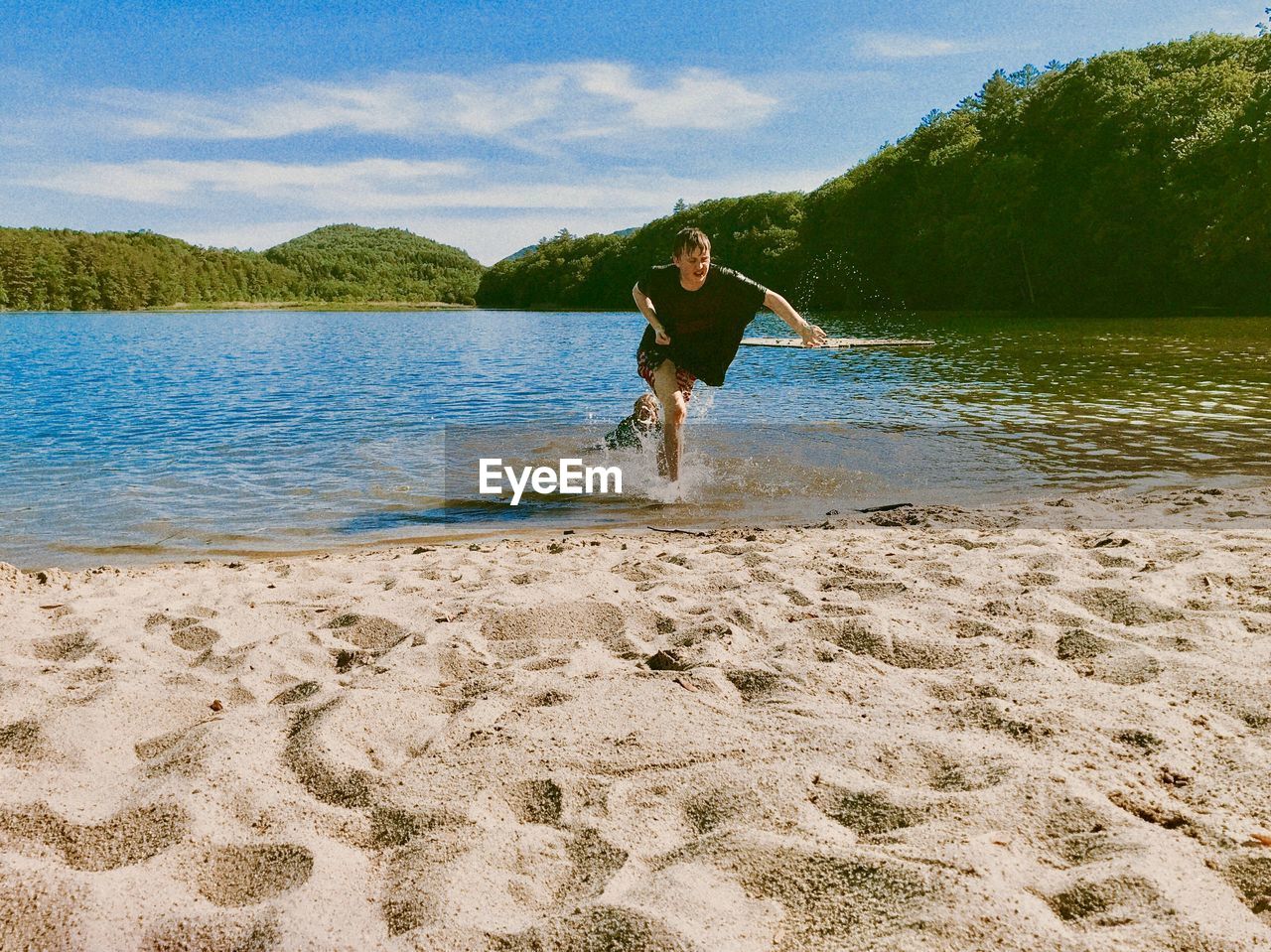 My children playing in the water at the beach