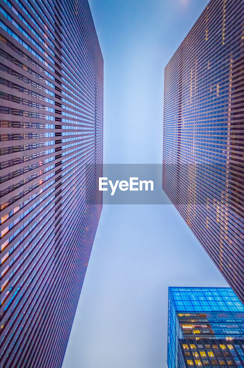 Low angle view of modern buildings against sky