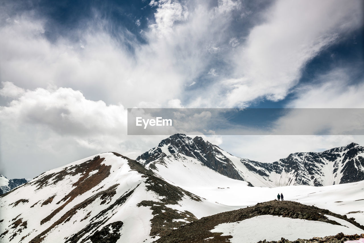 SNOW COVERED MOUNTAIN AGAINST SKY