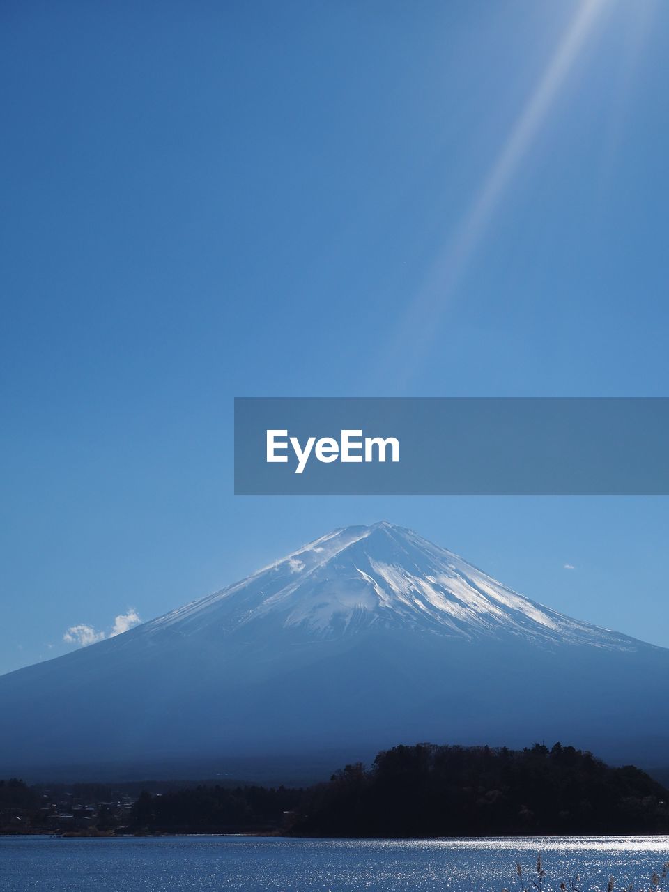 SNOWCAPPED MOUNTAINS AGAINST BLUE SKY