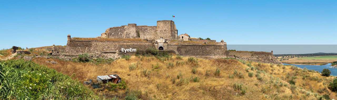 VIEW OF FORT AGAINST BLUE SKY