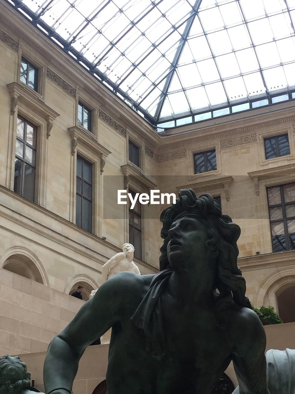 LOW ANGLE VIEW OF STATUE IN FRONT OF MUSEUM