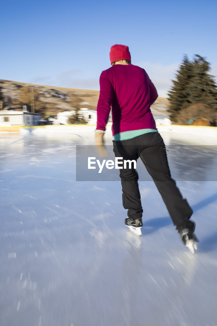 A woman ice skating in phillipsburg, montana