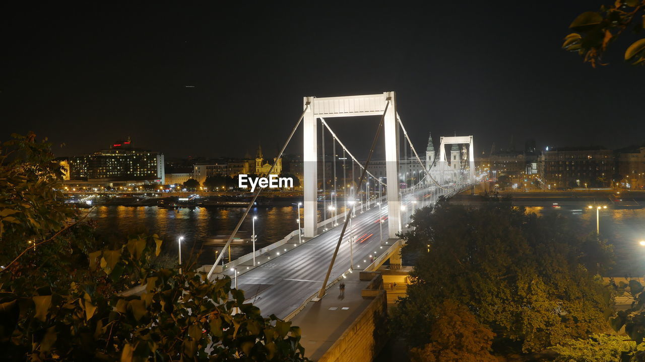 Illuminated elisabeth bridge over river danube against clear sky at night