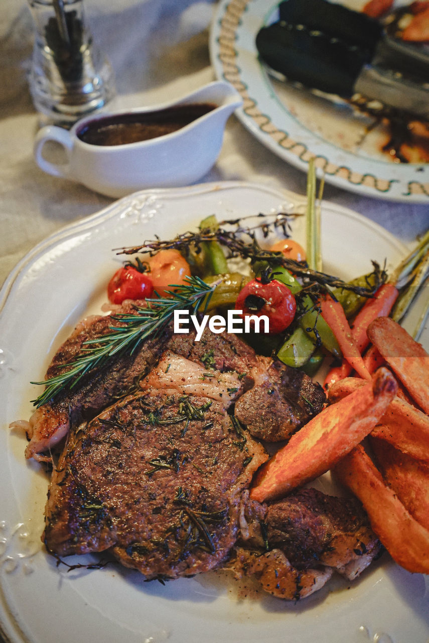 CLOSE-UP OF SERVED FOOD IN PLATE