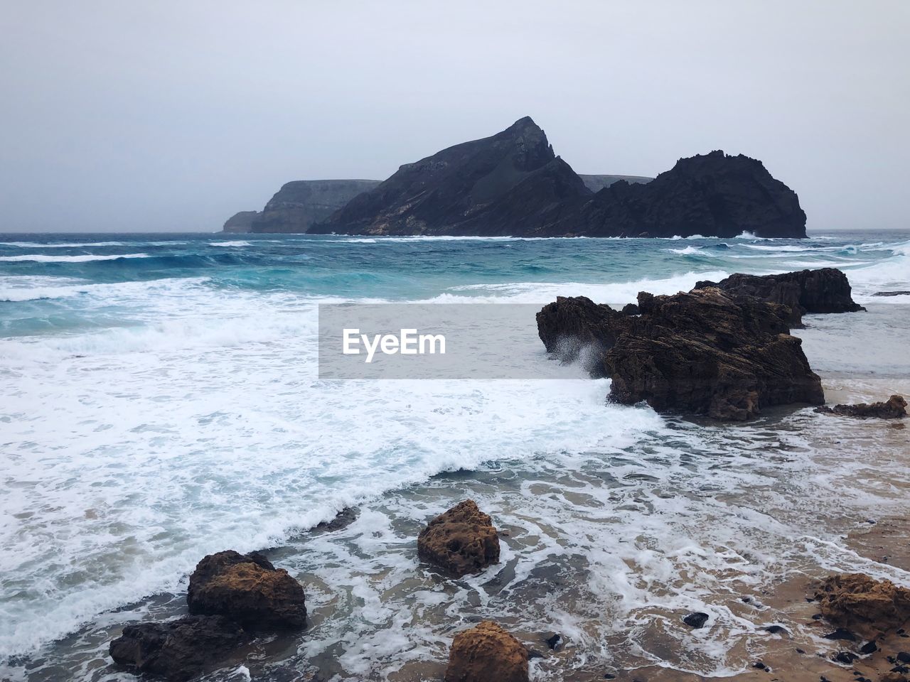 Waves against rocks in porto santo island 