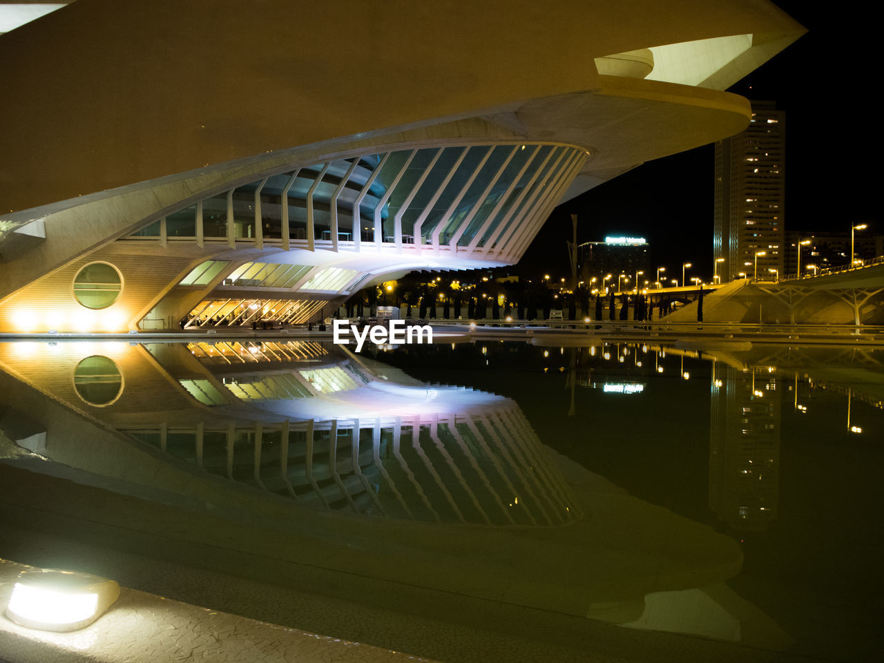 REFLECTION OF ILLUMINATED LIGHTS IN WATER