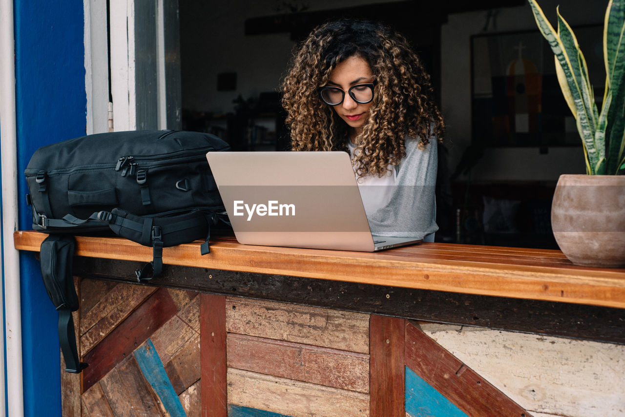 Young woman remote working on laptop 