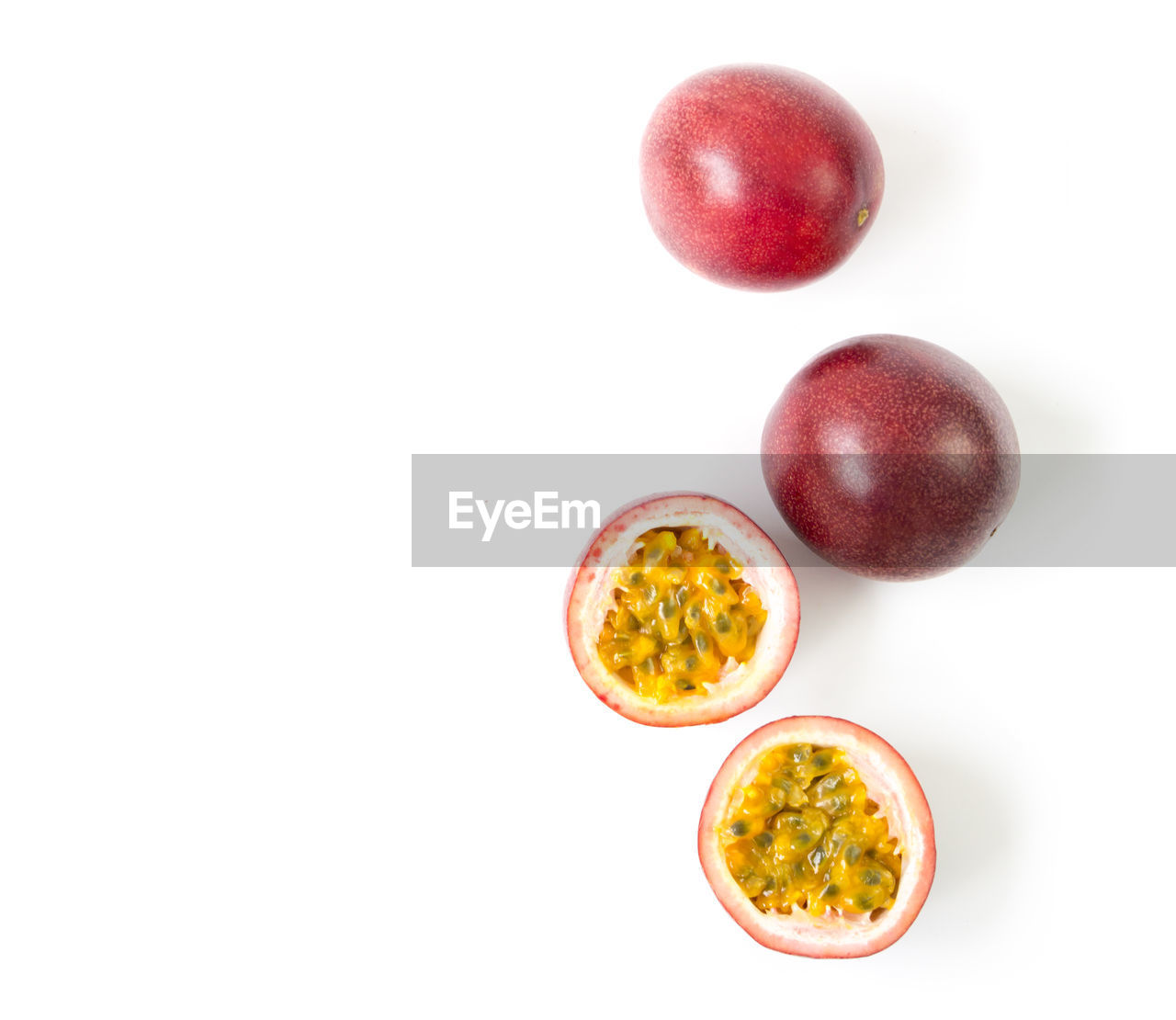 Directly above shot of passion fruits over white background