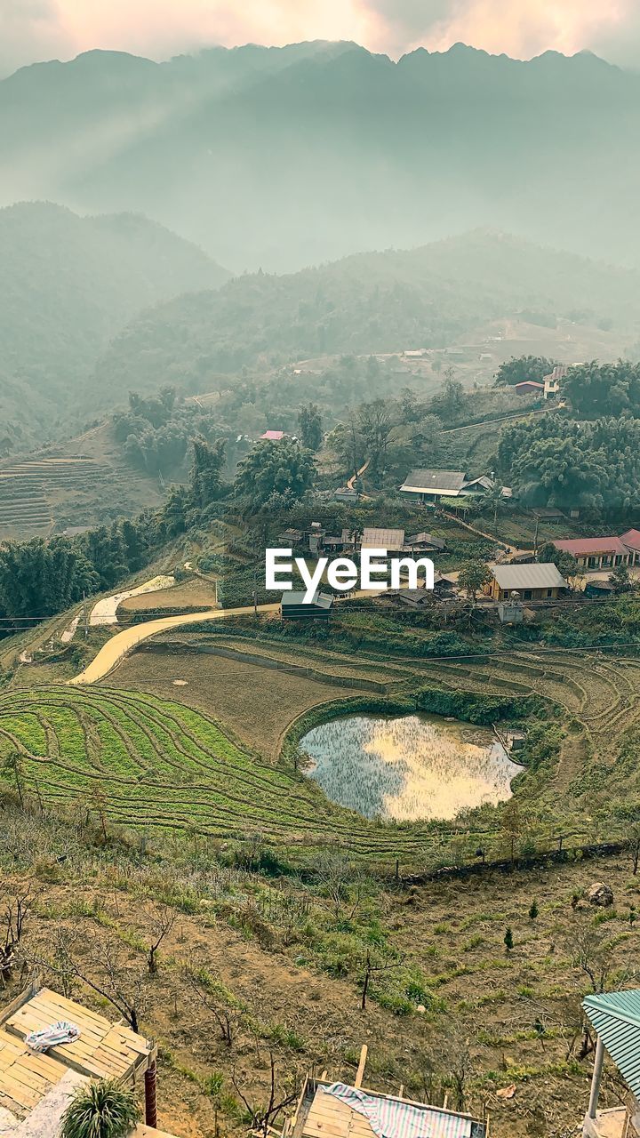 High angle view of field against mountains