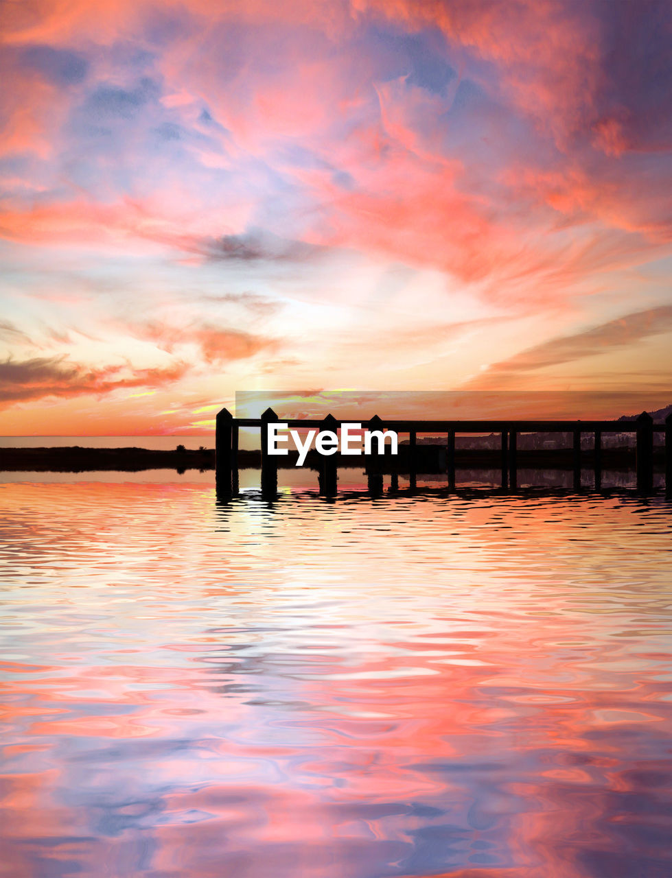 water, sky, sunset, cloud, beauty in nature, sea, nature, dawn, horizon, reflection, scenics - nature, tranquility, pier, architecture, afterglow, evening, tranquil scene, silhouette, orange color, built structure, dramatic sky, wood, travel destinations, idyllic, environment, outdoors, landscape, beach, land, no people, ocean, multi colored, travel, sun, shore, relaxation, seascape, holiday, summer, red sky at morning, trip, horizon over water, vacation, jetty, twilight, romantic sky, sunlight, bridge, tourism
