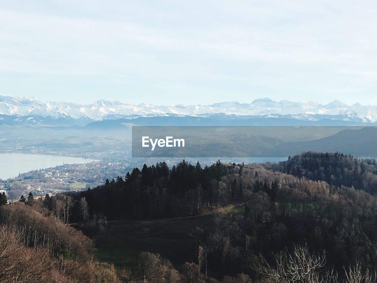 Scenic view of landscape and mountains against sky