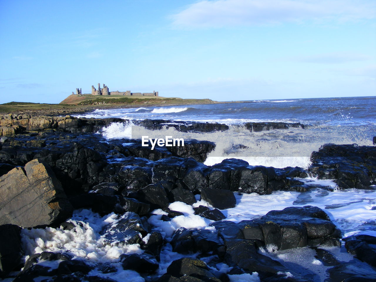 Scenic view of sea against blue sky