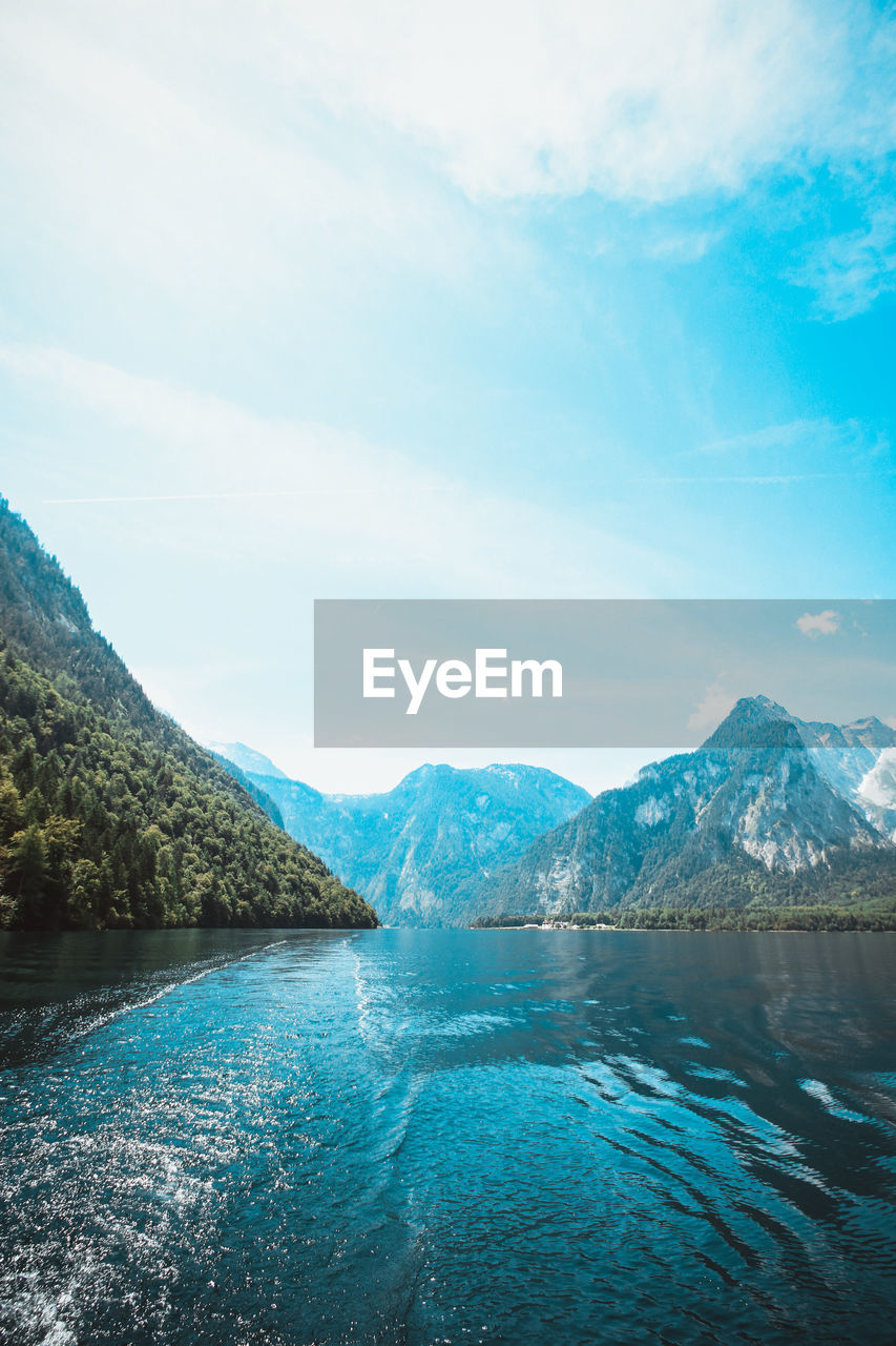 Scenic view of lake and mountains against sky