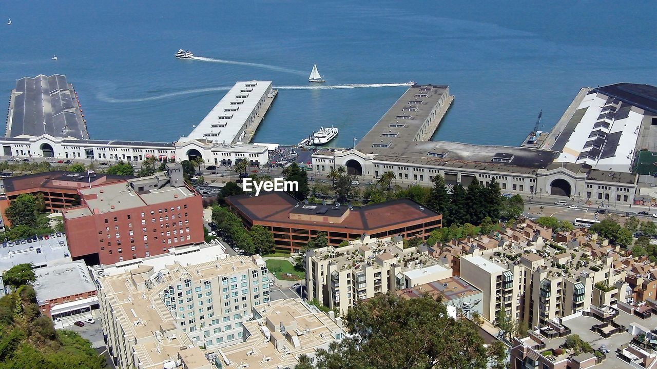 HIGH ANGLE VIEW OF BUILDINGS IN CITY AGAINST SKY