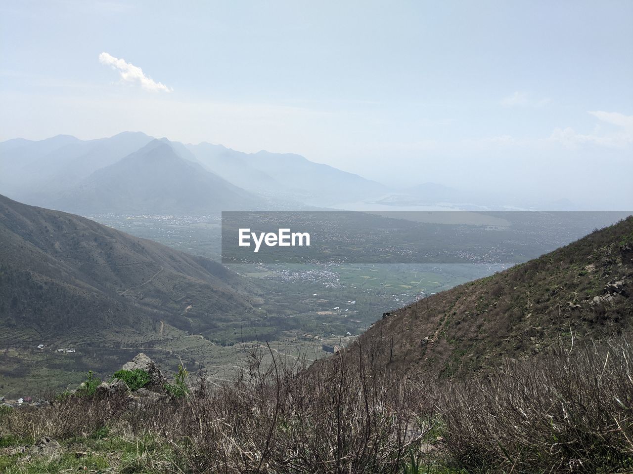SCENIC VIEW OF LAND AND MOUNTAINS AGAINST SKY