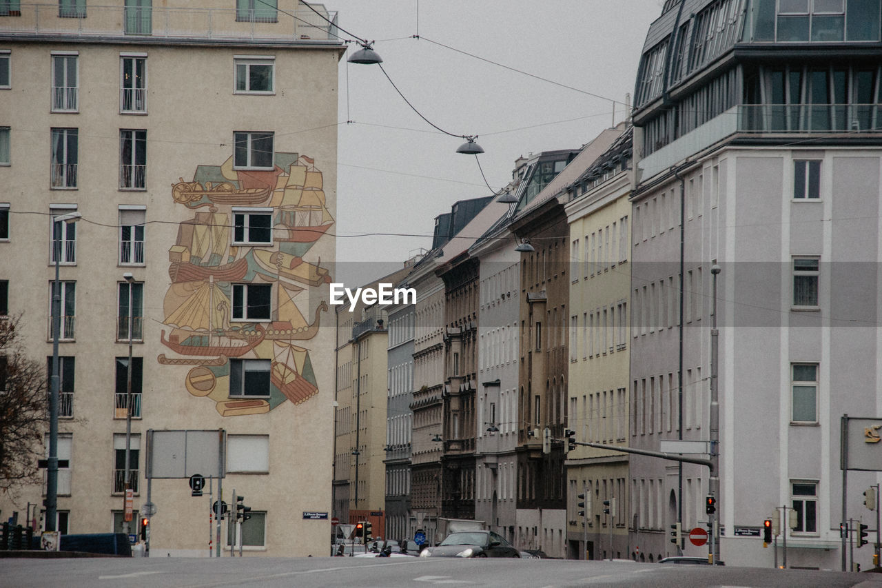 STREET AMIDST BUILDINGS IN CITY