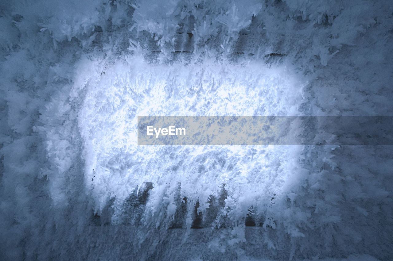 Ice covered window of a frozen house