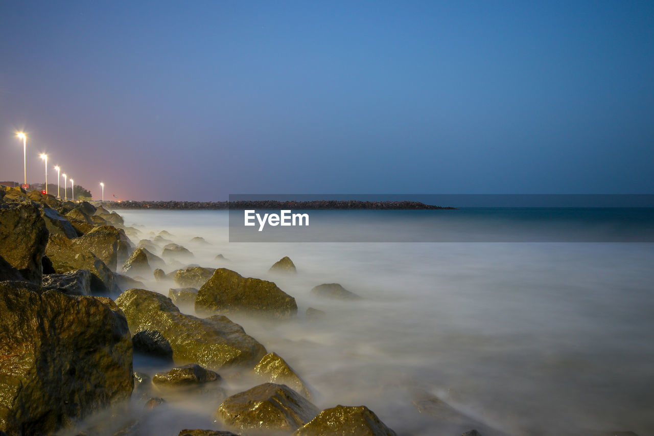 Scenic view of sea against clear sky