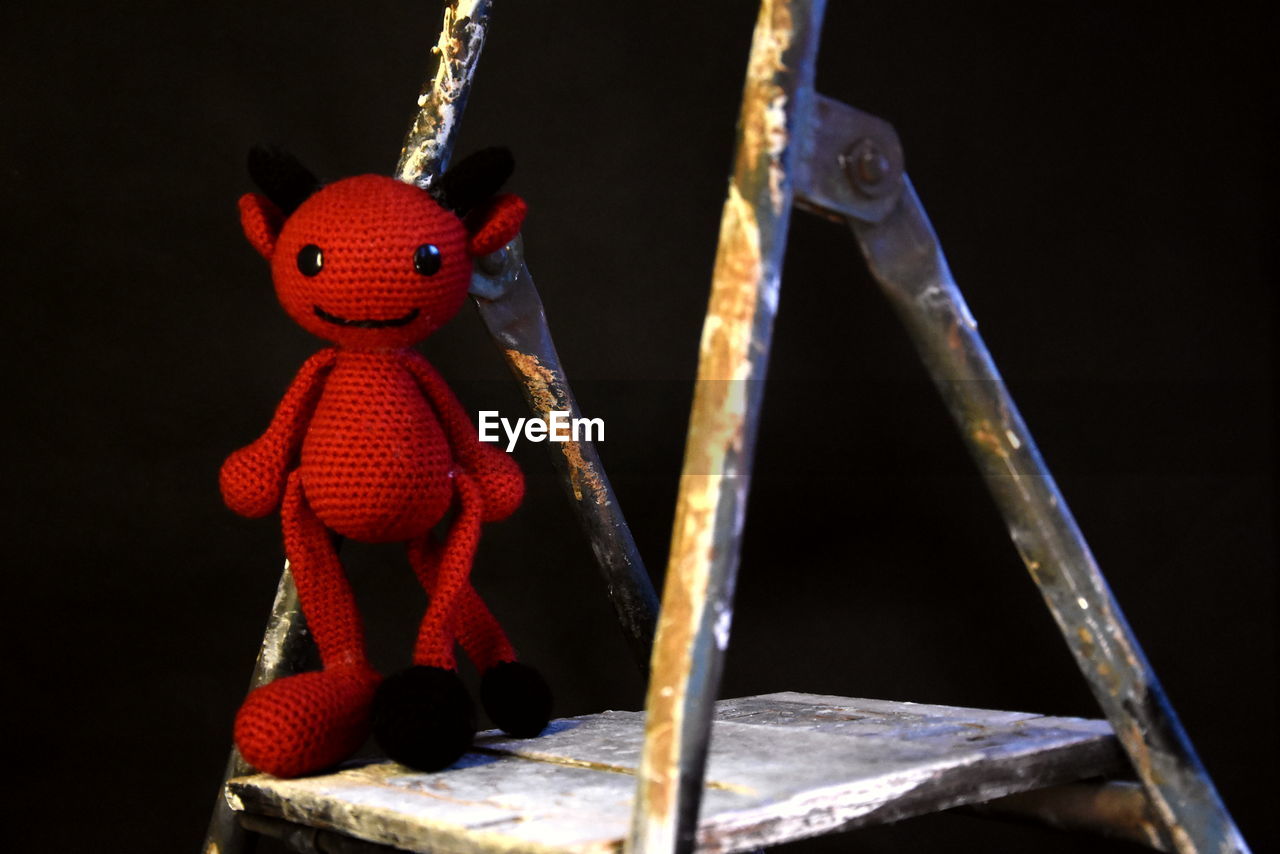 red, toy, representation, no people, human representation, black background, art, cartoon, studio shot, craft, indoors, doll, creativity