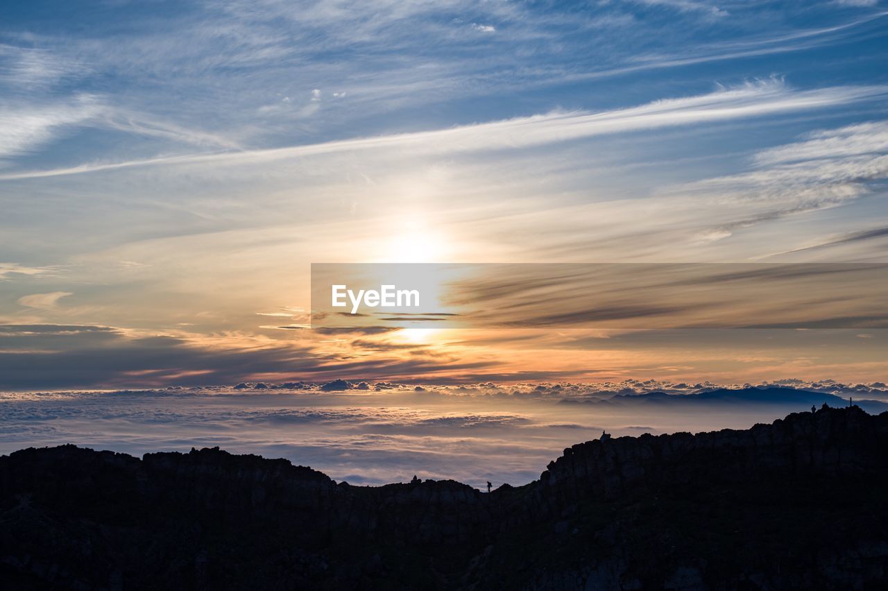 SCENIC VIEW OF SILHOUETTE LANDSCAPE AGAINST SKY DURING SUNSET