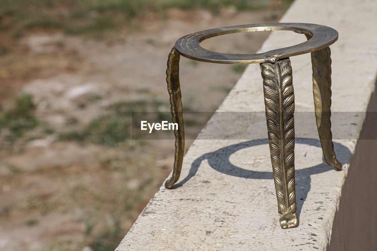 table, wood, no people, nature, focus on foreground, day, furniture, sunlight, iron, shadow, land, outdoors, sand, metal, absence