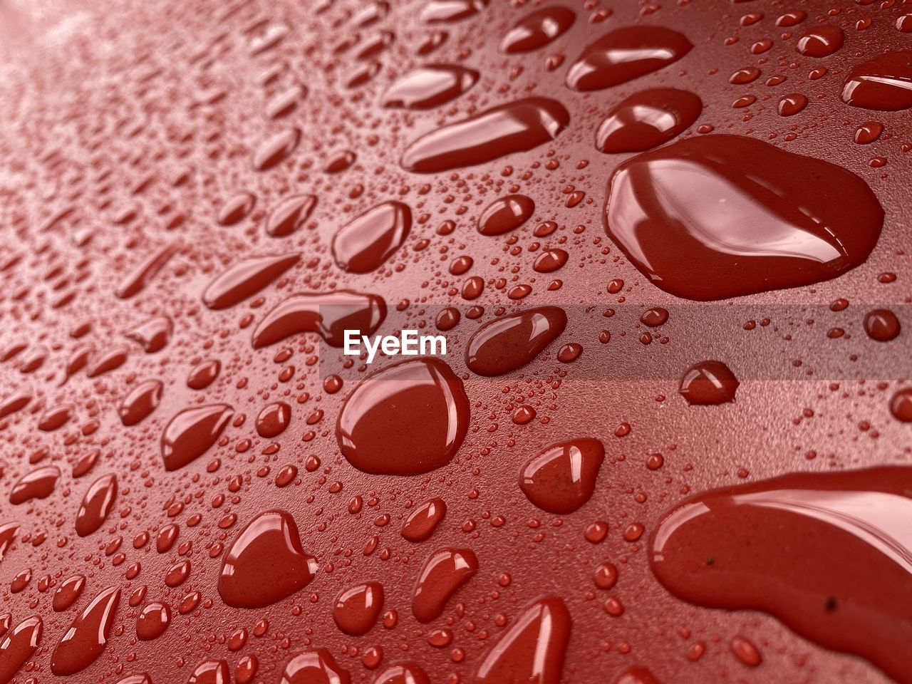 FULL FRAME SHOT OF WET GLASS WITH RAINDROPS ON FLOOR