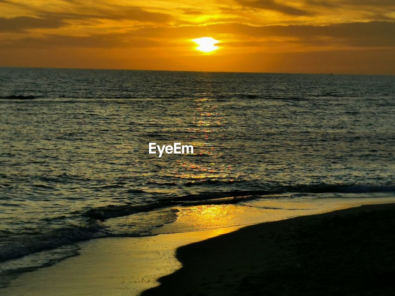 Scenic view of sea against sky during sunset