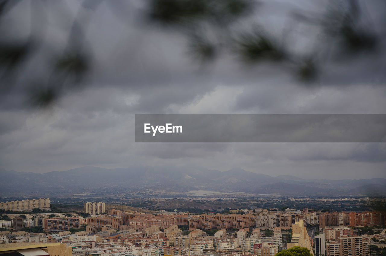 architecture, building exterior, built structure, city, building, cityscape, residential district, cloud, sky, nature, horizon, no people, tree, morning, high angle view, skyline, travel destinations, outdoors, town, city life, house, landscape, community, day, environment, mountain