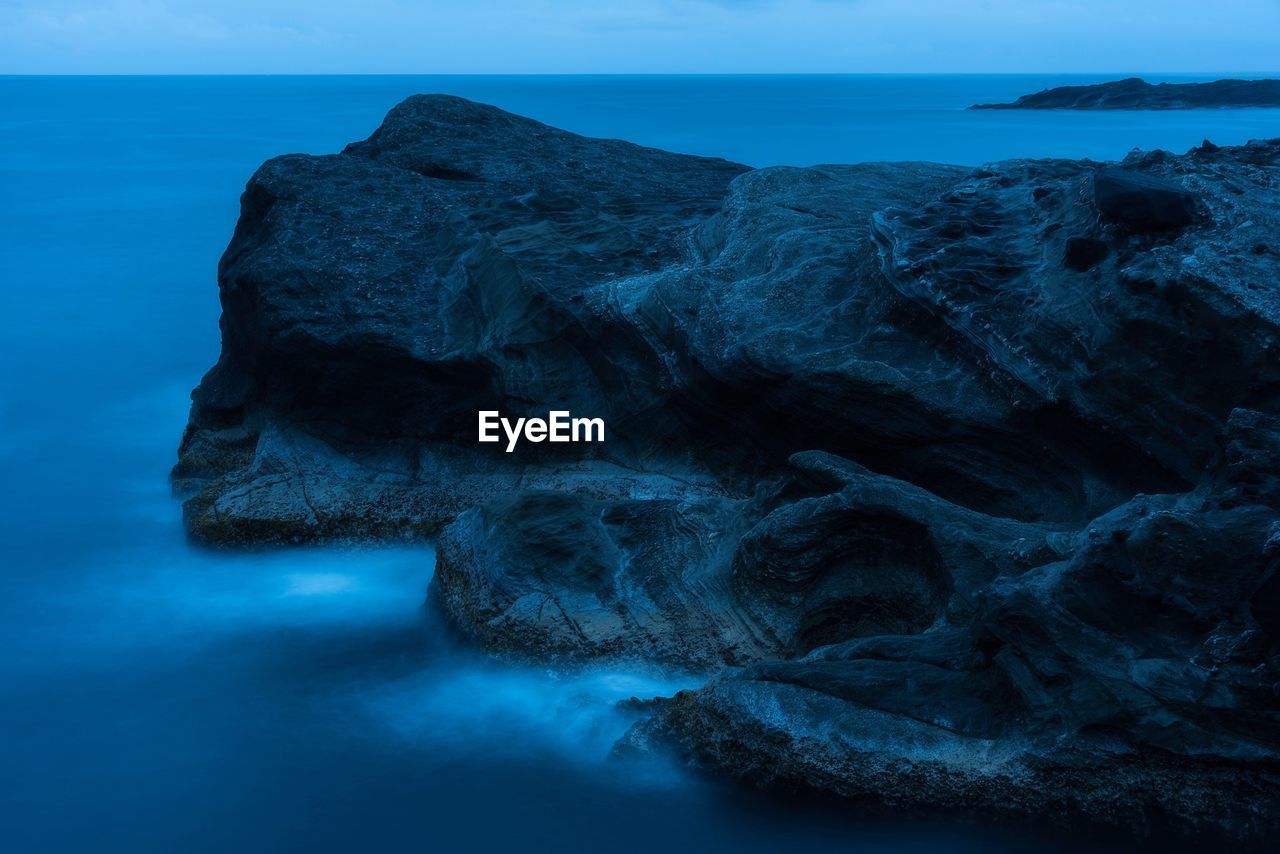 Close-up of rock formation in sea