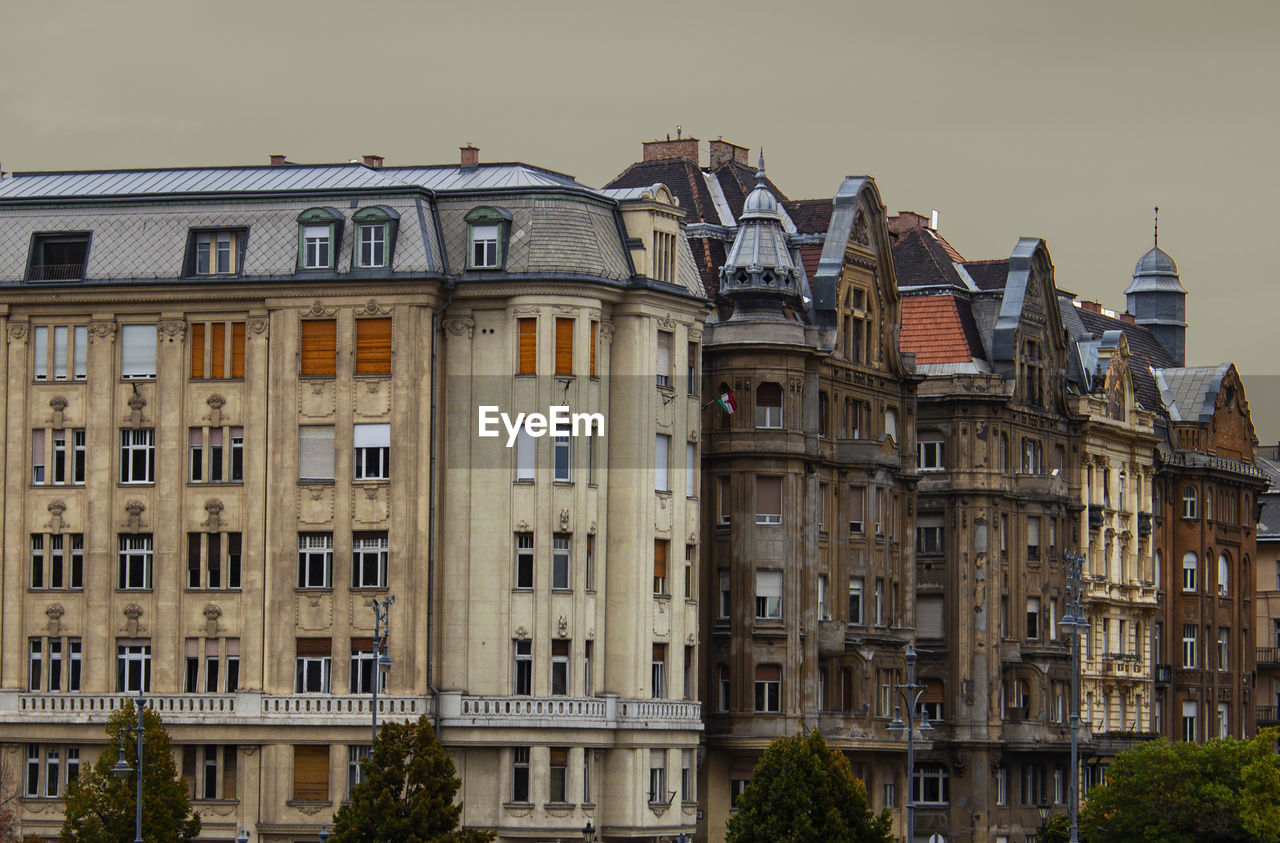 Facade of historical pastel-colored buildings in the old town of budapest, hungary, europe. 