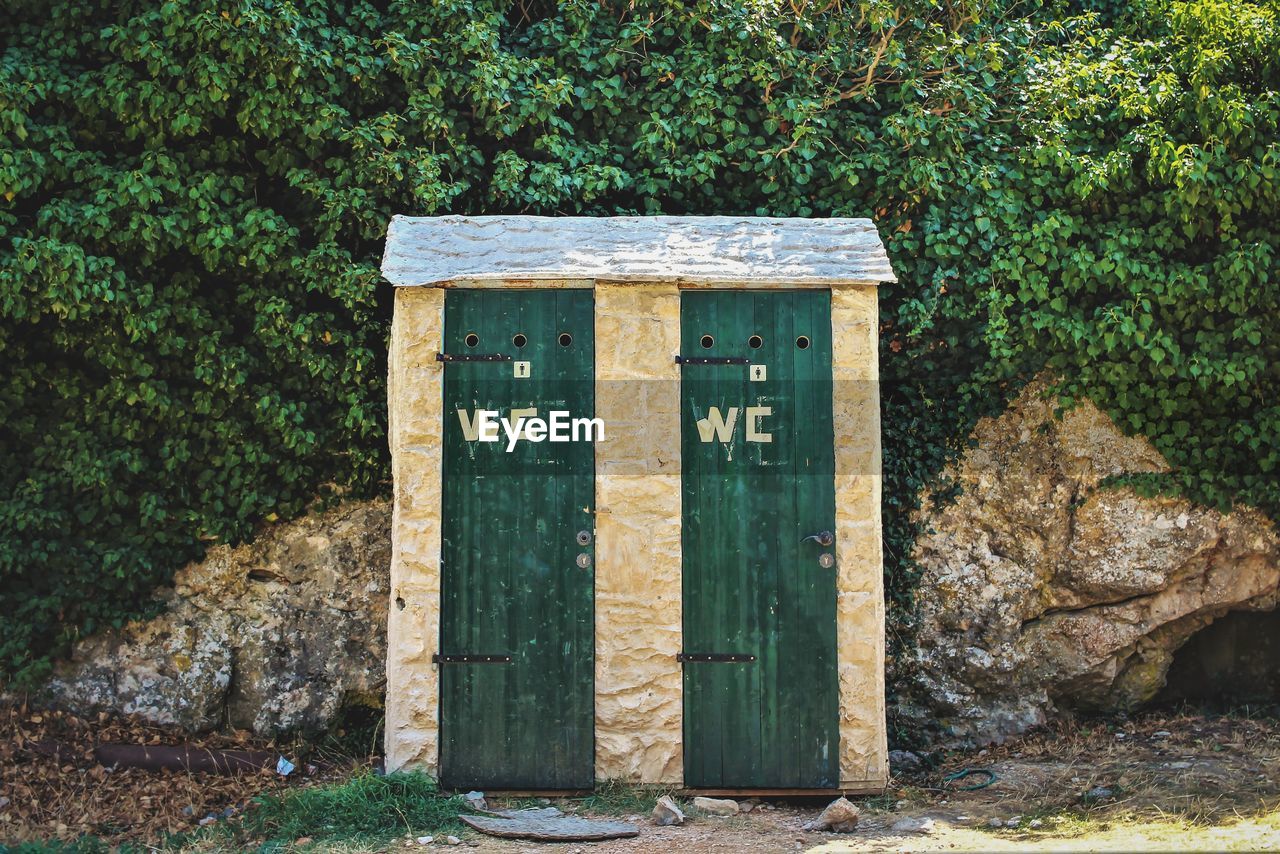 Public bathrooms on  tree in forest