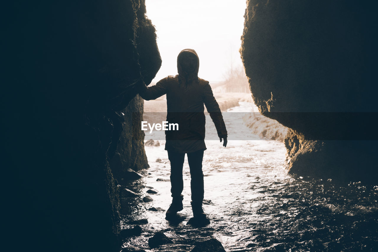 Full length of man standing in cave