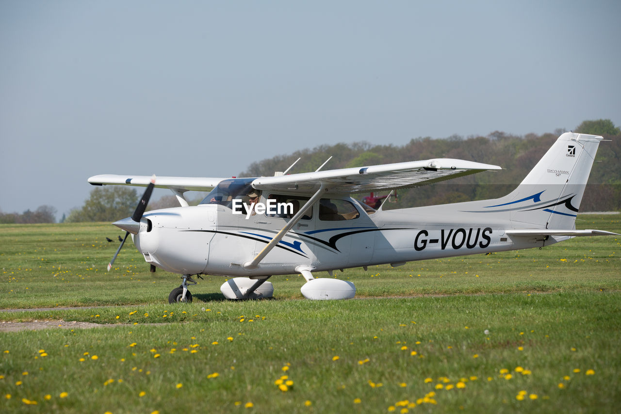 AIRPLANE ON FIELD