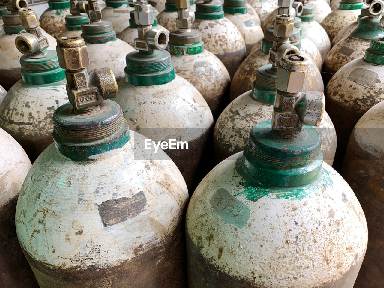HIGH ANGLE VIEW OF OLD BOTTLES IN CONTAINER
