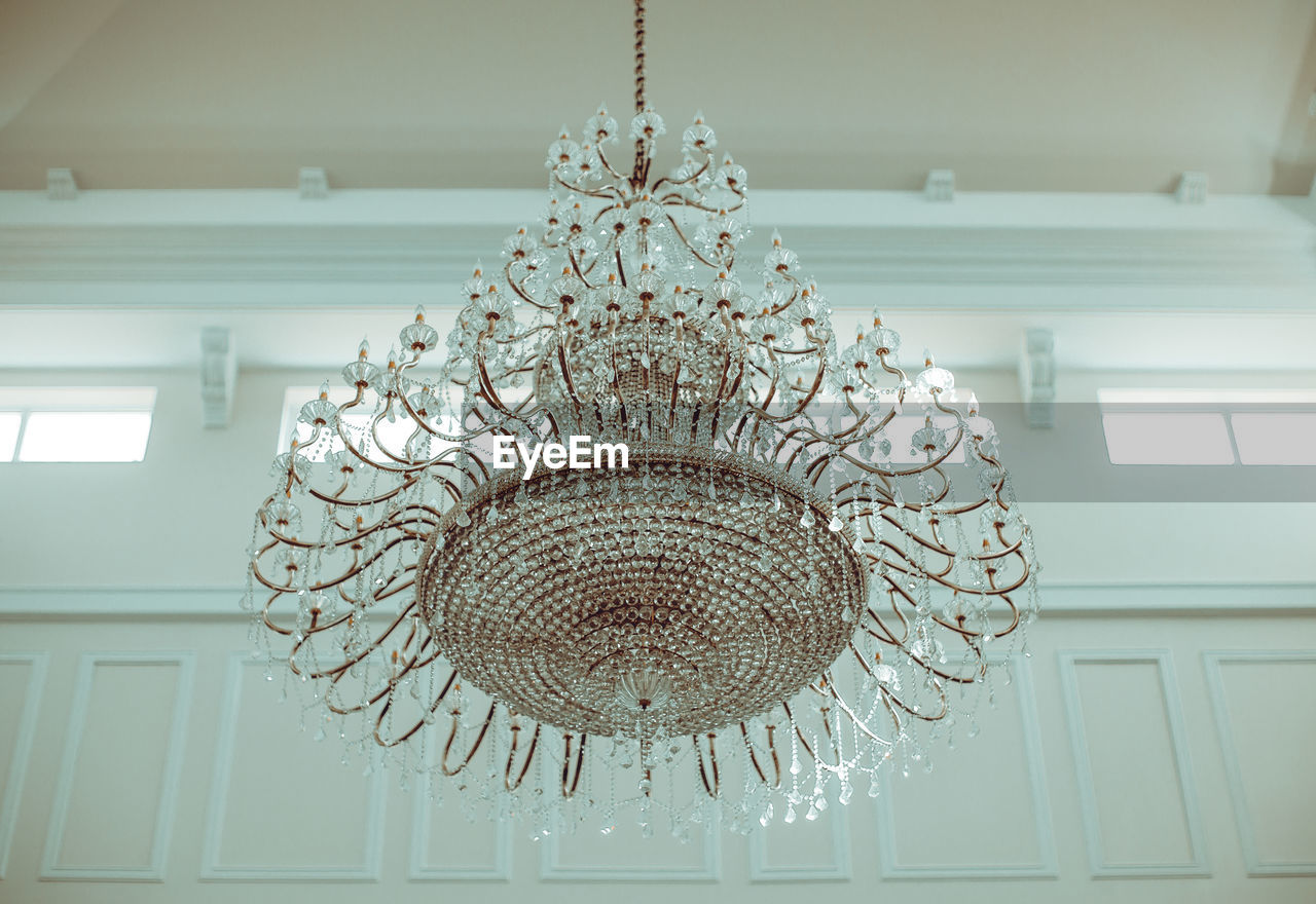 Low angle view of chandelier hanging at home
