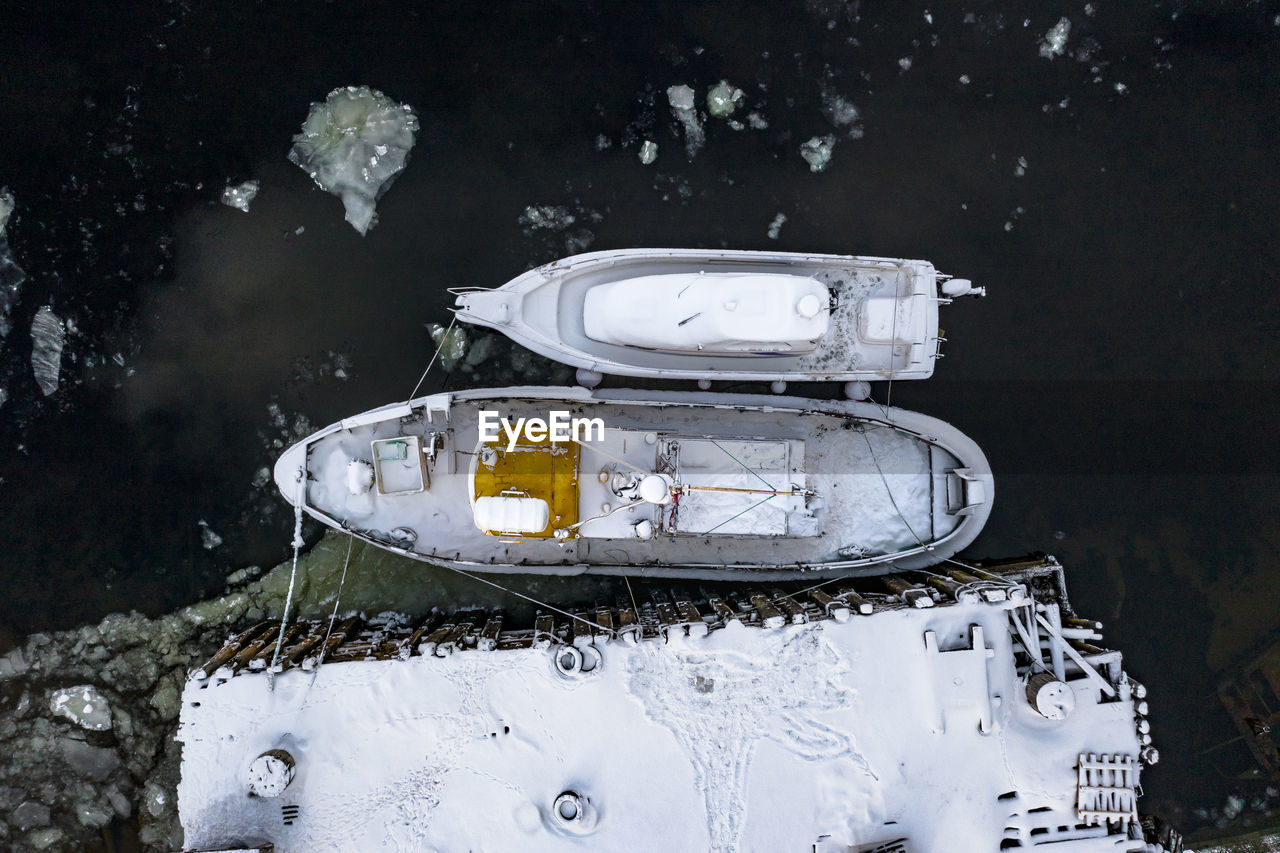 High angle view of abandoned car on field during winter