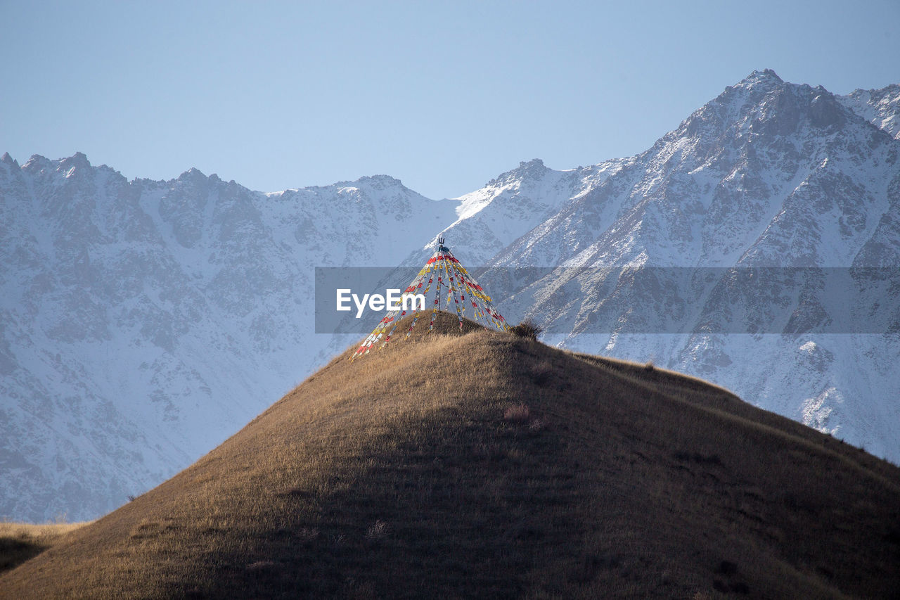 VIEW OF SNOWCAPPED MOUNTAIN AGAINST SKY